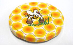 2603-6  /  7433-22 Zatvarač fi 82. / žuti s pčelicom u sredini - 740kom/kut 5201-8/2603-6